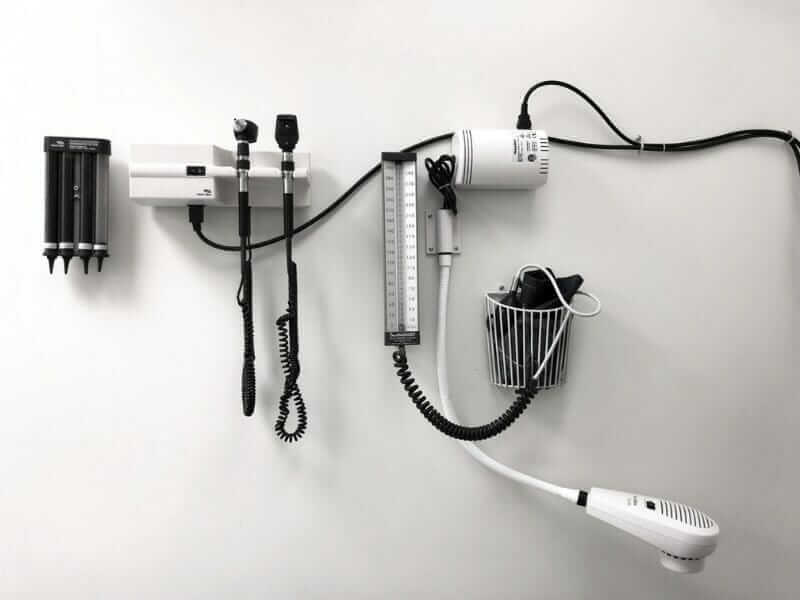 Diagnostic medical equipment on a wall, showcasing precision tools for pest control insights at Old Bay Pest Control in Annapolis, MD.