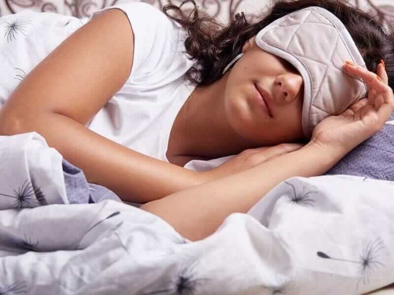 Woman sleeping peacefully with eye mask, representing pest-free comfort by Old Bay Pest Control in Annapolis, MD, US.